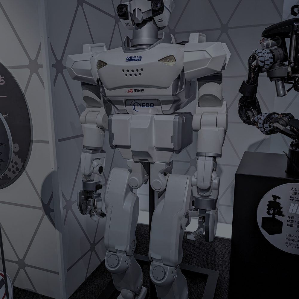 Humanoid robot standing on display in a robotics exhibition hall
